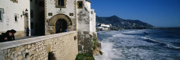 Tourists in a church beside the sea, Sitges, Spain