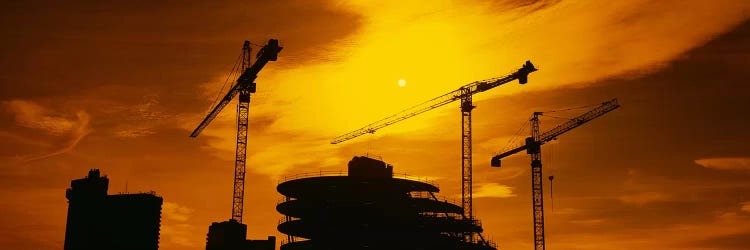 Cranes In An Orange Dusk, London, England, United Kingdom