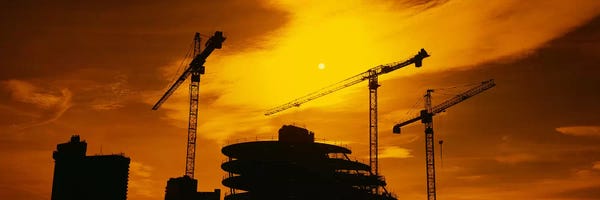 London: Cranes In An Orange Dusk, London, England, United Kingdom by Panoramic Images
