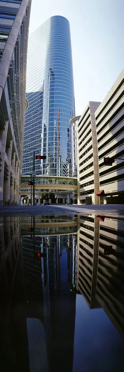 Reflection of buildings on water, Houston, Texas, USA by Panoramic Images canvas print