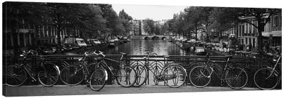 Bicycle Leaning Against A Metal Railing On A Bridge, Amsterdam, Netherlands Canvas Art Print - Panoramic Photography