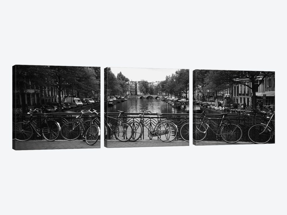 Bicycle Leaning Against A Metal Railing On A Bridge, Amsterdam, Netherlands by Panoramic Images 3-piece Canvas Art