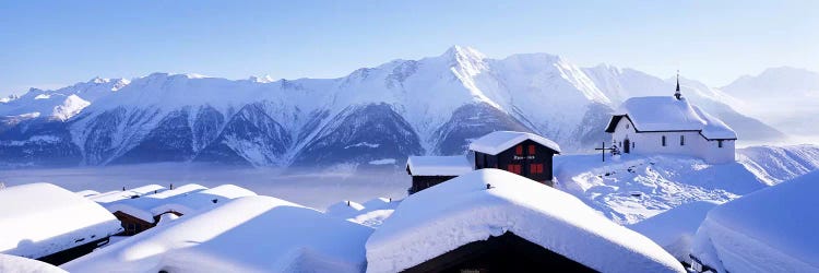 Snow Covered Chapel and Chalets Swiss Alps Switzerland