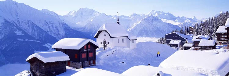 Snow Covered Chapel and Chalets Swiss Alps Switzerland