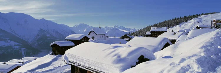 Snow Covered Chapel and Chalets Swiss Alps Switzerland