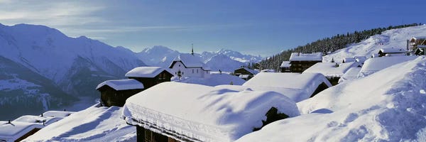 Snow Covered Chapel and Chalets Swiss Alps Switzerland