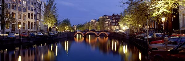 Netherlands: Night View Along Canal Amsterdam The Netherlands by Panoramic Images