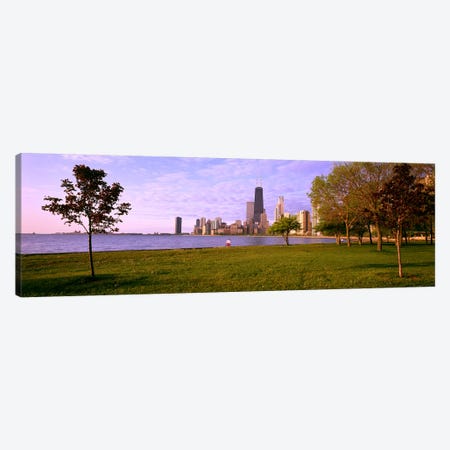 Trees in a park with lake and buildings in the background, Lincoln Park, Lake Michigan, Chicago, Illinois, USA Canvas Print #PIM4075} by Panoramic Images Art Print