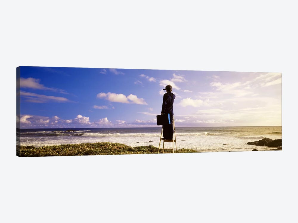 Businessman On A Ladder Looking Through Binoculars On A Beach, California, USA by Panoramic Images 1-piece Canvas Art Print