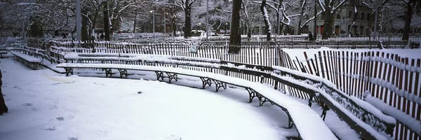 Manhattan: Snowcapped benches in a park, Washington Square Park, Manhattan, New York City, New York State, USA by Panoramic Images
