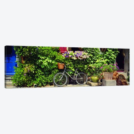 Bicycle Against A Wall Covered With Plants And Flowers, Rochefort-en-Terre, Brittany, France Canvas Print #PIM4204} by Panoramic Images Canvas Art