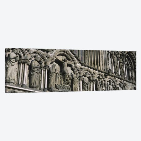 Low angle view of statues carved on wall of a cathedralTrondheim, Norway Canvas Print #PIM4224} by Panoramic Images Canvas Artwork