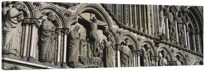 Low angle view of statues carved on wall of a cathedralTrondheim, Norway Canvas Art Print - Norway Art