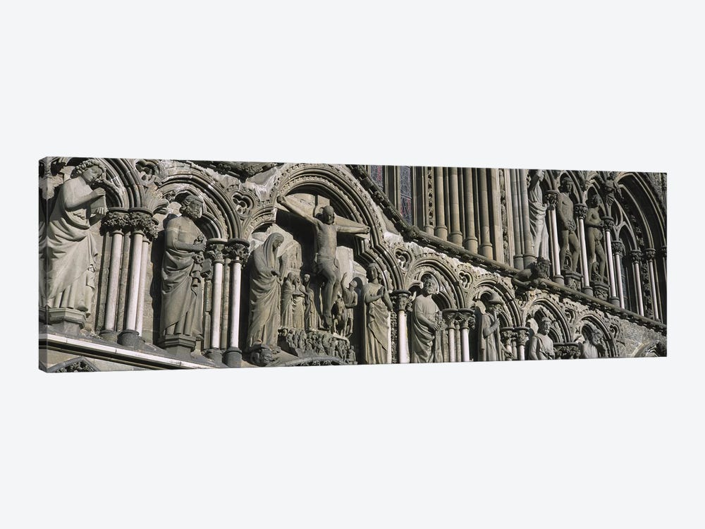 Low angle view of statues carved on wall of a cathedralTrondheim, Norway by Panoramic Images 1-piece Art Print