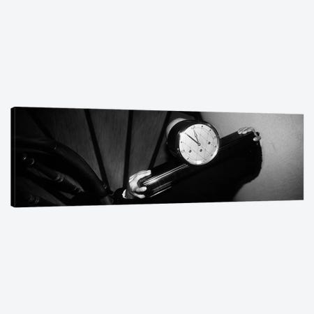 Man Carrying Clock Up Stairs on Shoulders Canvas Print #PIM4245} by Panoramic Images Canvas Wall Art