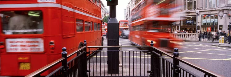 Blurred Motion View Of Double-Decker Buses, Oxford Circus Station Circle, London, England