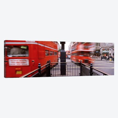 Blurred Motion View Of Double-Decker Buses, Oxford Circus Station Circle, London, England Canvas Print #PIM4337} by Panoramic Images Canvas Wall Art