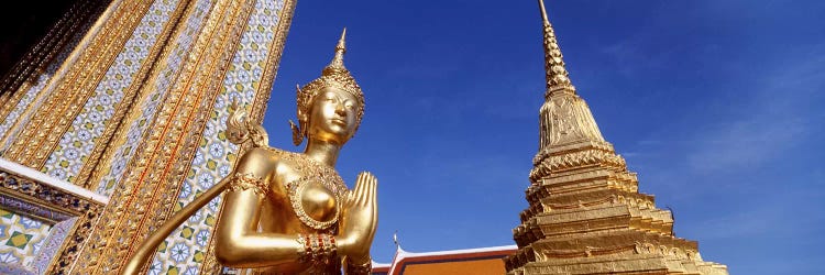 Low angle view of a statueWat Phra Kaeo, Grand Palace, Bangkok, Thailand by Panoramic Images wall art