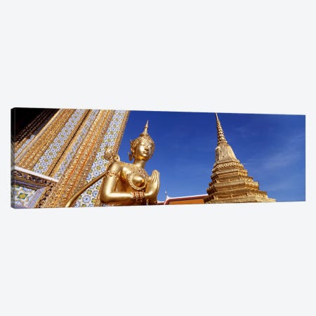 Low angle view of a statueWat Phra Kaeo, Grand Palace, Bangkok, Thailand Canvas Print #PIM4341} by Panoramic Images Canvas Artwork