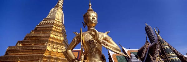 The Grand Palace: Low angle view of a statueWat Phra Kaeo, Grand Palace, Bangkok, Thailand by Panoramic Images