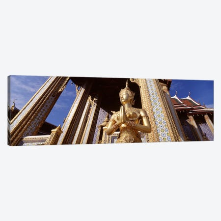 Low angle view of a statueWat Phra Kaeo, Grand Palace, Bangkok, Thailand Canvas Print #PIM4344} by Panoramic Images Art Print
