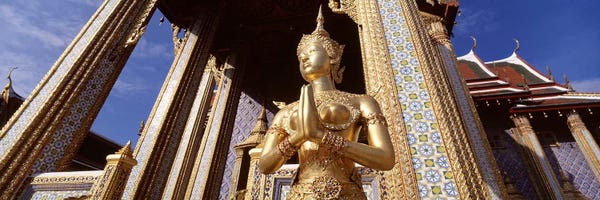 Thailand: Low angle view of a statueWat Phra Kaeo, Grand Palace, Bangkok, Thailand by Panoramic Images