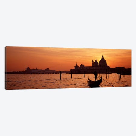 Santa Maria della Salute With A Gondoleer And His Boat On The Grand Canal In The Foreground, Venice, Italy Canvas Print #PIM4356} by Panoramic Images Canvas Artwork