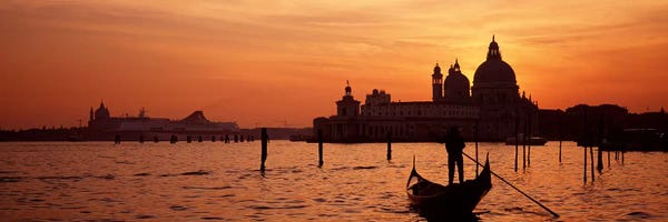Places Of Worship: Santa Maria della Salute With A Gondoleer And His Boat On The Grand Canal In The Foreground, Venice, Italy by Panoramic Images