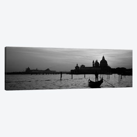 Santa Maria della Salute In B&W With A Gondoleer And His Boat On The Grand Canal In The Foreground, Venice, Italy Canvas Print #PIM4356bw} by Panoramic Images Canvas Wall Art