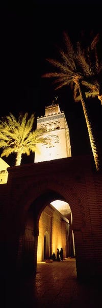 Islam: Low angle view of a mosque lit up at night, Koutoubia Mosque, Marrakesh, Morocco by Panoramic Images