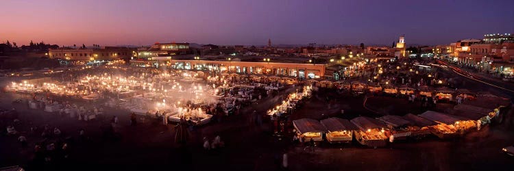 High angle view of a market lit up at dusk, Djemaa El Fna, Medina Quarter, Marrakesh, Morocco