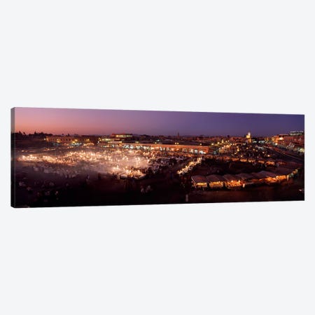 High angle view of a market lit up at dusk, Djemaa El Fna, Medina Quarter, Marrakesh, Morocco Canvas Print #PIM4382} by Panoramic Images Canvas Artwork