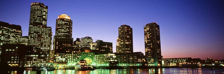 Skyscrapers at the waterfront lit up at night, Boston, Massachusetts, USA