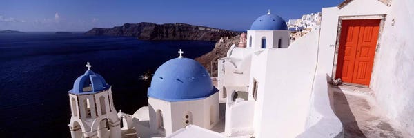 Blue Domed Church Santorini: Church in a city, Santorini, Cyclades Islands, Greece by Panoramic Images