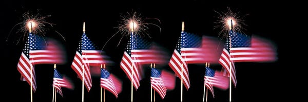 American Flags: US Flags And Fireworks by Panoramic Images
