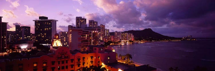 Buildings lit up at dusk, Waikiki, Oahu, Hawaii, USA