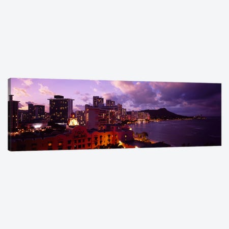 Buildings lit up at dusk, Waikiki, Oahu, Hawaii, USA Canvas Print #PIM4492} by Panoramic Images Canvas Wall Art