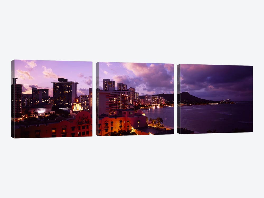 Buildings lit up at dusk, Waikiki, Oahu, Hawaii, USA by Panoramic Images 3-piece Canvas Art
