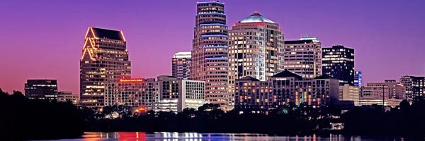 Blue: USA, Texas, Austin, View of an urban skyline at night by Panoramic Images