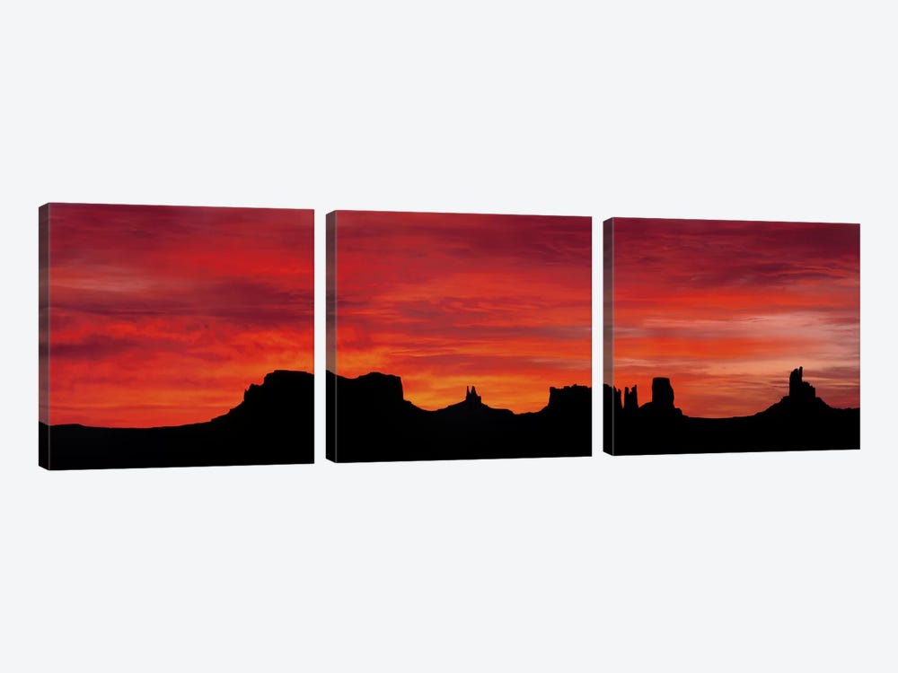 Silhouette Of Monument Valley's Buttes Across A Deep Orange Sunset by Panoramic Images 3-piece Canvas Art