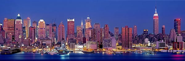 New York City Skylines: USA, New York, New York City, West Side, Skyscrapers in a city during dusk by Panoramic Images
