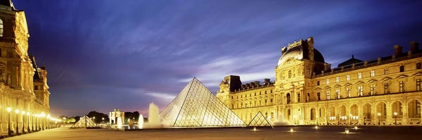 The Louvre Museum: Majestic Sky Over An Illuminated Louvre Museum Complex, Paris, France by Panoramic Images