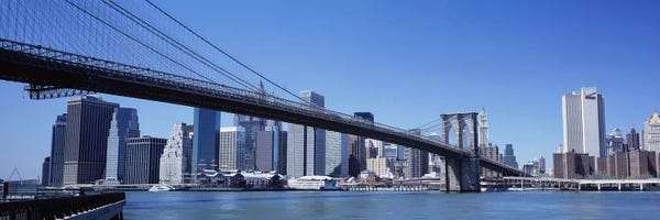 Brooklyn Bridge: USA, New York State, New York City, Brooklyn Bridge, Skyscrapers in a city by Panoramic Images