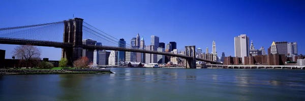 Brooklyn Bridge: USA, New York State, New York City, Brooklyn Bridge, Skyscrapers in a city #2 by Panoramic Images