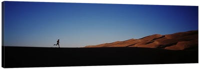 USA, Colorado, Great Sand Dunes National Monument, Runner jogging in the park Canvas Art Print - Desert Landscape Photography