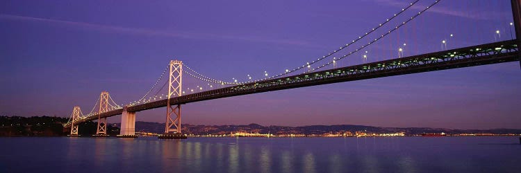 Low angle view of a bridge at dusk, Oakland Bay Bridge, San Francisco, California, USA