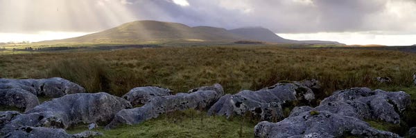 Sun Beams Breaking Through The Clouds Over Ingleborough, Yorkshire Dales National Park, England, United Kingdom