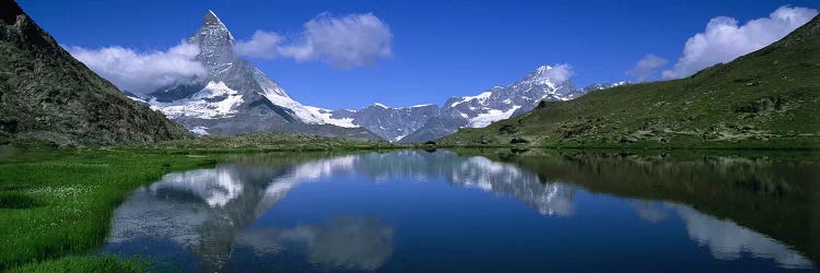 A Snow-Covered Matterhorn And Its Reflection In Riffelsee, Pennine Alps, Switzerland