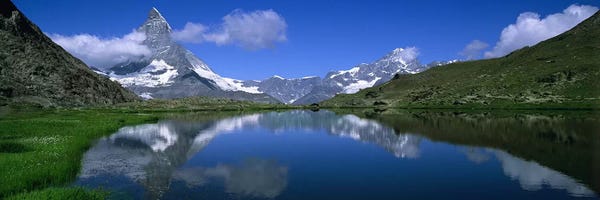 A Snow-Covered Matterhorn And Its Reflection In Riffelsee, Pennine Alps, Switzerland