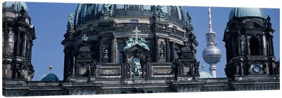 Low angle view of a church, Berliner Dom, with Television Tower (Fernsehturm) in distance, Berlin, Germany Canvas Art Print - Christian Art